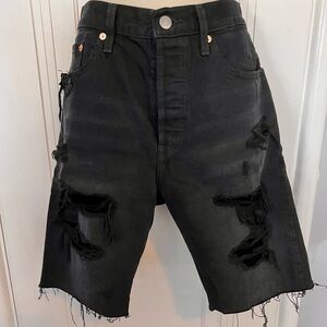 Levi’s frayed denim shorts. Mid-thigh length. Size 28